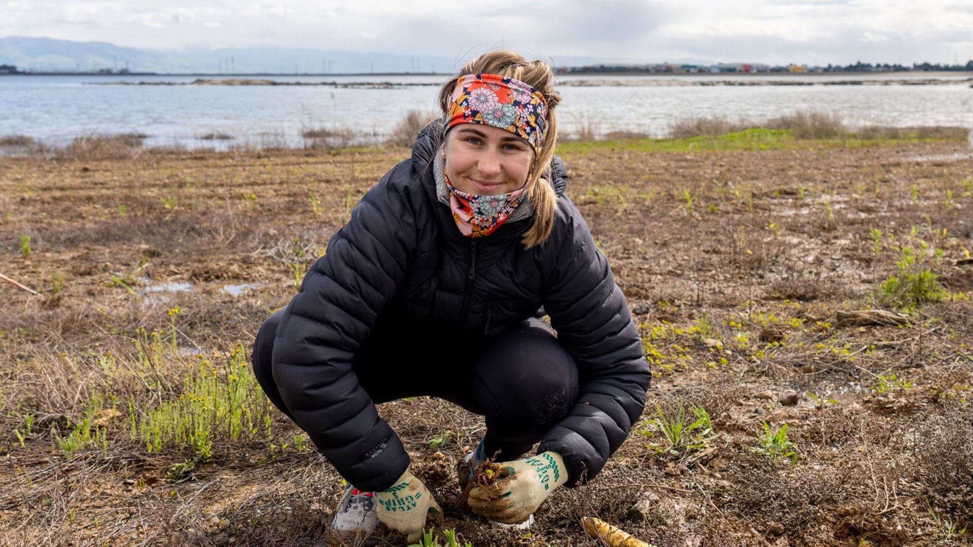 girl works on field: restore our bays